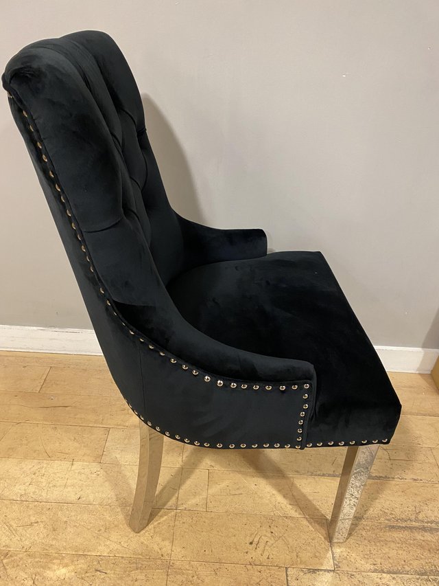 Preview of the first image of Dining chairs black with crome legs.