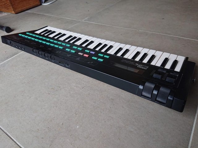 Preview of the first image of Classic 1980s Yamaha DX100 synthesizer in great condition.