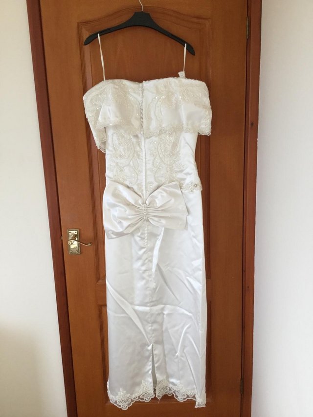 Preview of the first image of Bridal wedding dress, size 16 but could fit a 14. Detachable.