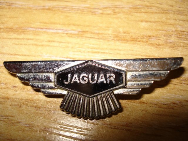 Preview of the first image of JAGUAR BADGE AND BRASS BUTTON.