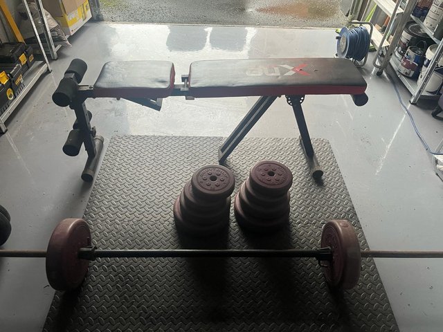 Preview of the first image of Weight bench and weights.