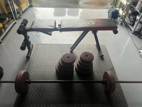 Image 1 of Weight bench and weights
