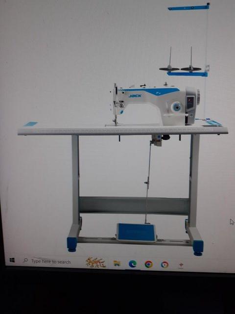 Preview of the first image of INDUSTRIALTYPE SEWING MACHINE INCLUDING TABLE.
