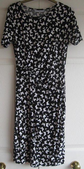 Preview of the first image of Black and White Butterfly patterned Dress, size 12.