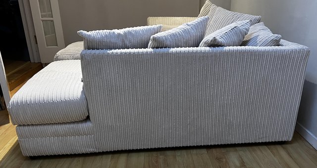 Preview of the first image of 3 seater corner sofa & footstool in cream corduroy.