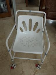 Preview of the first image of MOBILE SHOWER CHAIR WITH LOCKING WHEELS.