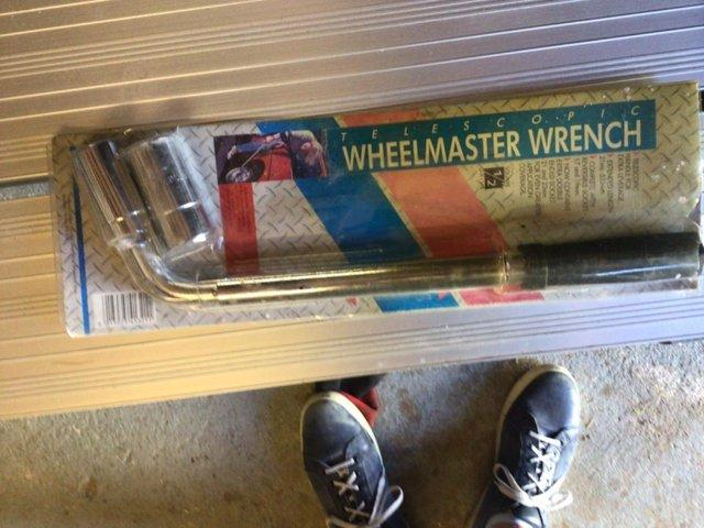 Preview of the first image of Motor Vehicle Wheel Wrench in original packaging..