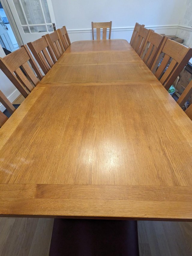 Preview of the first image of Oak Dining Table + 12 Leather Chairs.