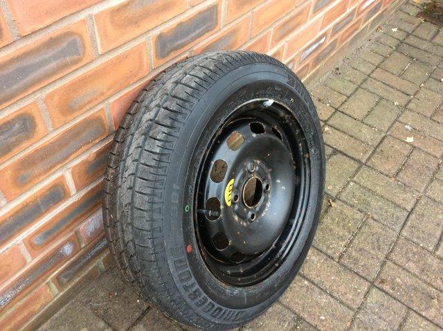 Preview of the first image of spare wheel and new Bridgestone tyre.