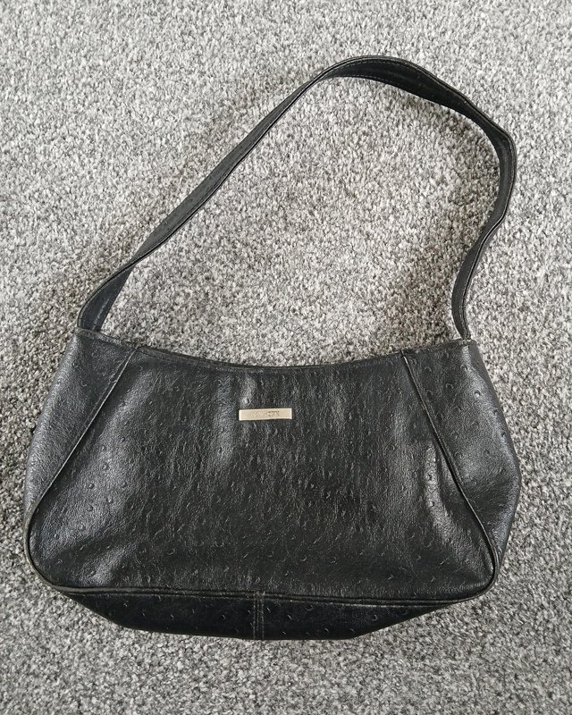 Preview of the first image of New York Ladies black handbag.