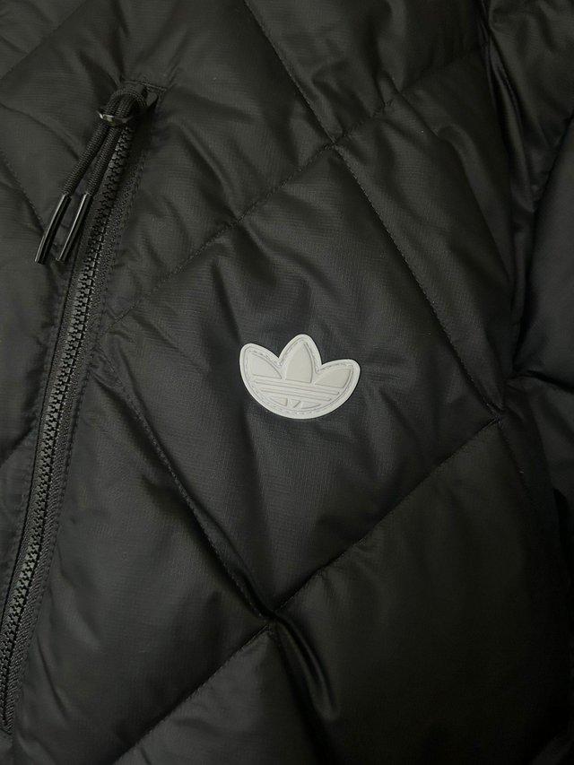Preview of the first image of Mens quilted Adidas jacket, with inside pocket.