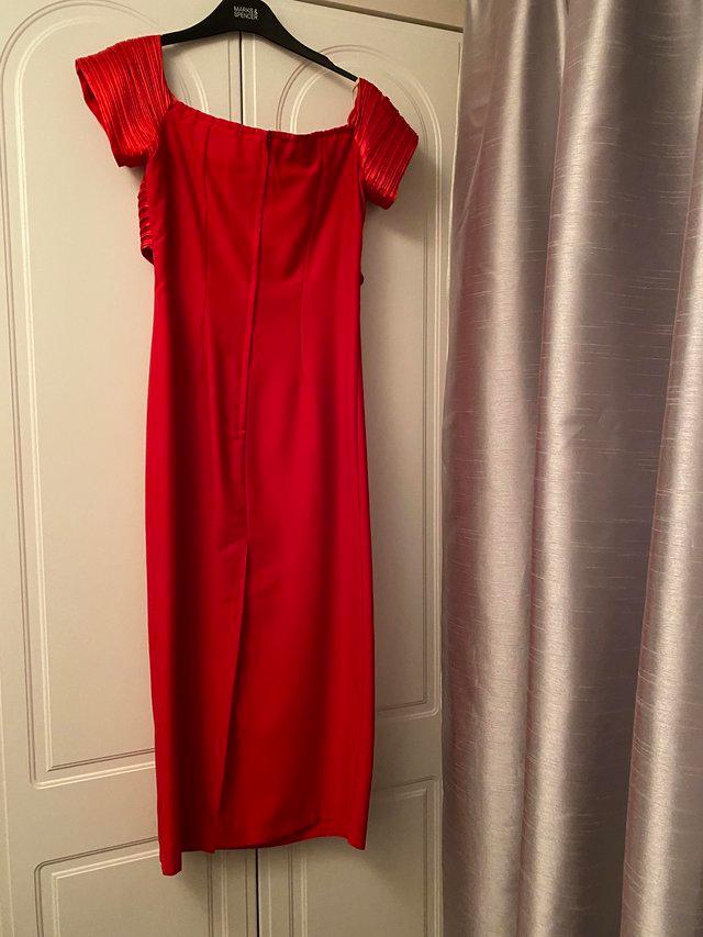 Preview of the first image of Tania Bryer Red Dress for any occasion.