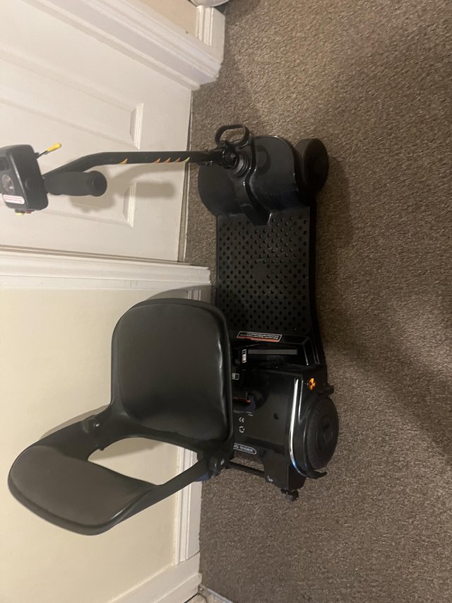Preview of the first image of Fold away mobility scooter fits in boot.