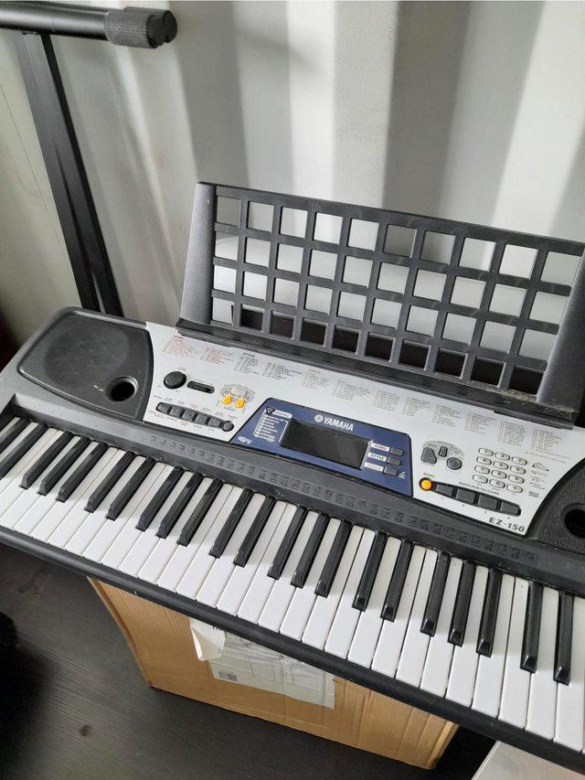 Preview of the first image of Bargain Yamaha keyboard with stand.