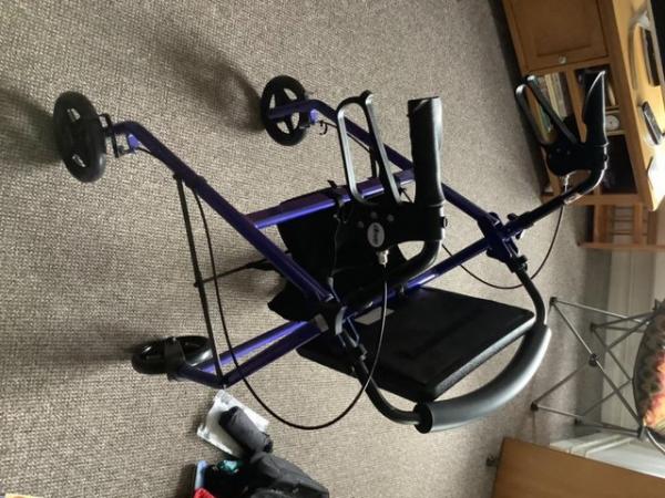 Image 1 of Unused brand new rollator blue.Very good 4 wheeler with seat