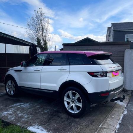 Image 1 of Pink & white Range Rover evoque.