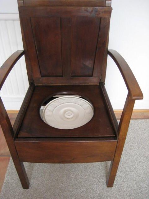 Preview of the first image of Antique Oak Commode Chair with China Pot & Lid.