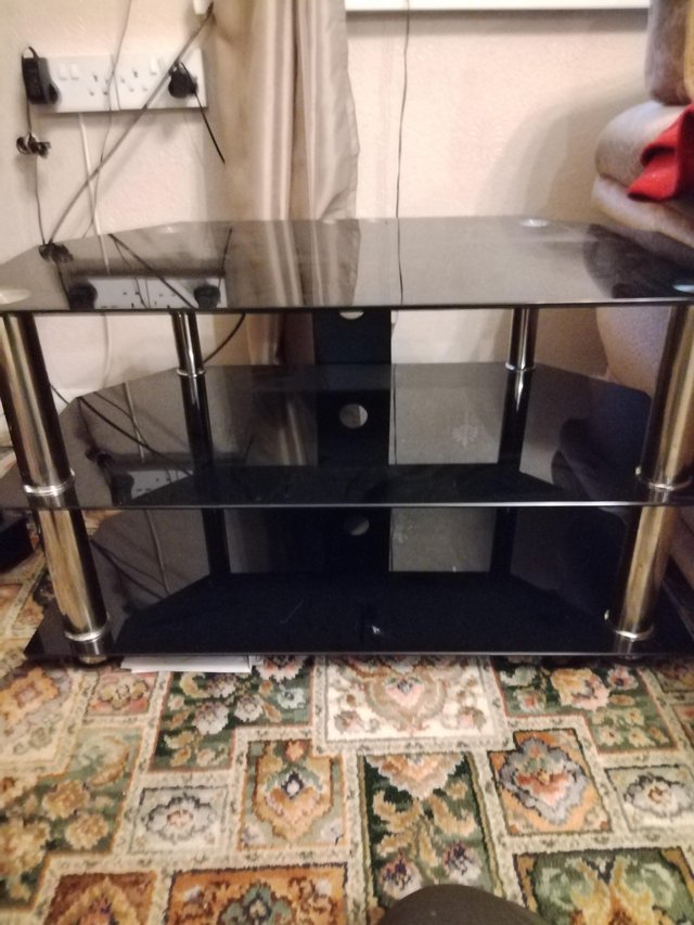 Preview of the first image of Glass tv stand black and silver.