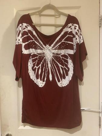 Image 1 of Top size 24. sequin's on a butterfly. By Proposal