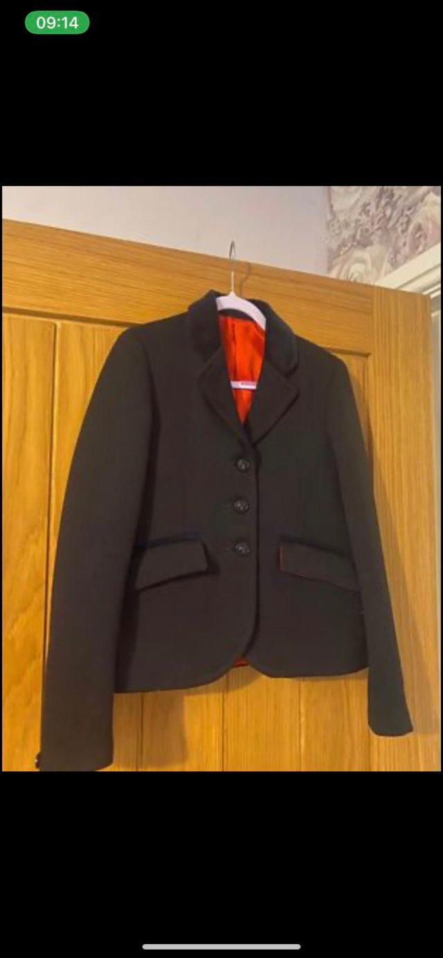 Preview of the first image of Le beau cheval navy show jacket like new size 26.