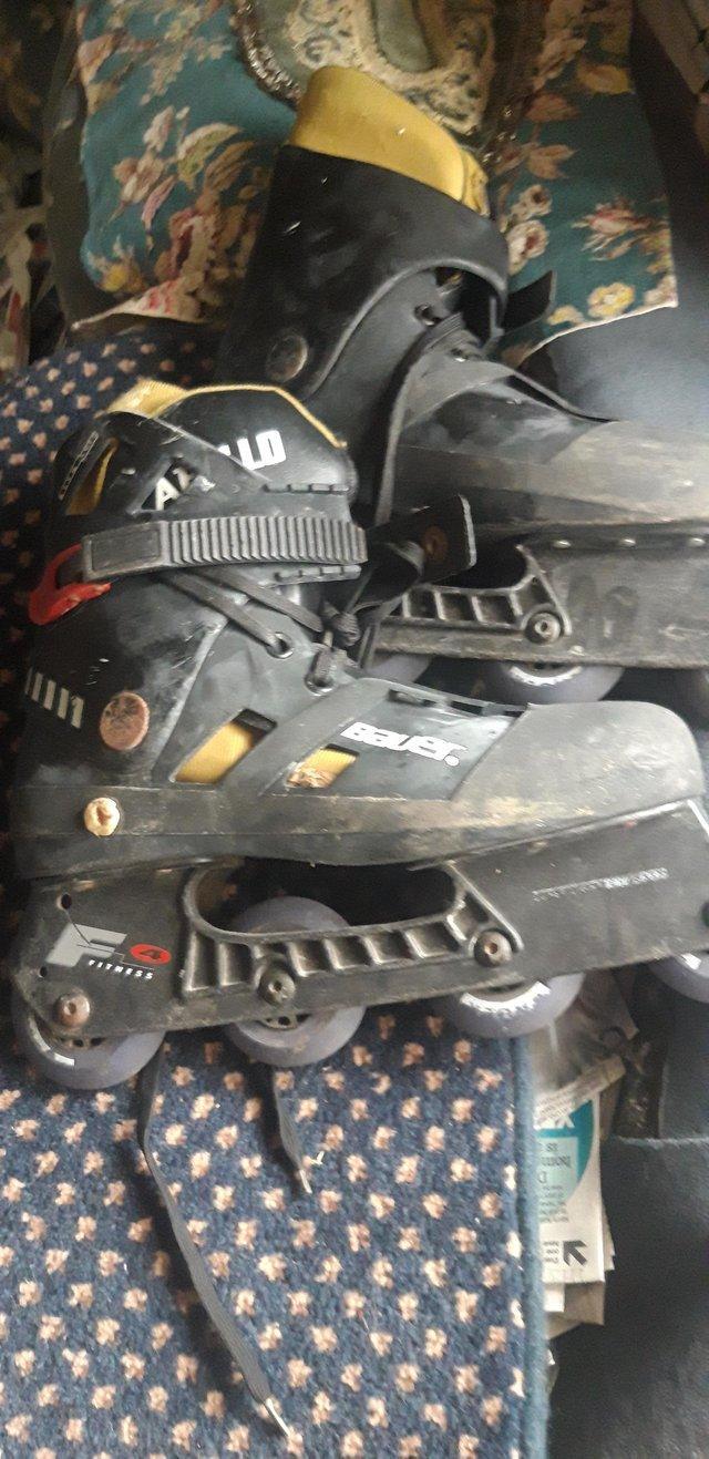 Preview of the first image of BAUER APOLLO 4X ROLLER WHEELS, SPIN GOOD , ON EACH BOOT.