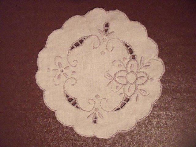 Preview of the first image of Vintage cut out work/beige embroidered white linen doily..