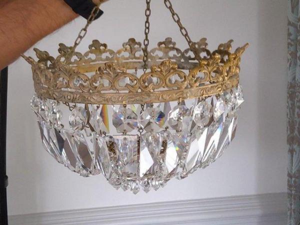 Image 1 of crystal and brass chandelier....................