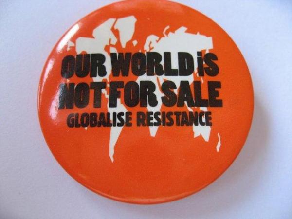 Image 1 of Globalise Resistance Our World Is Not For Sale Badge Pin
