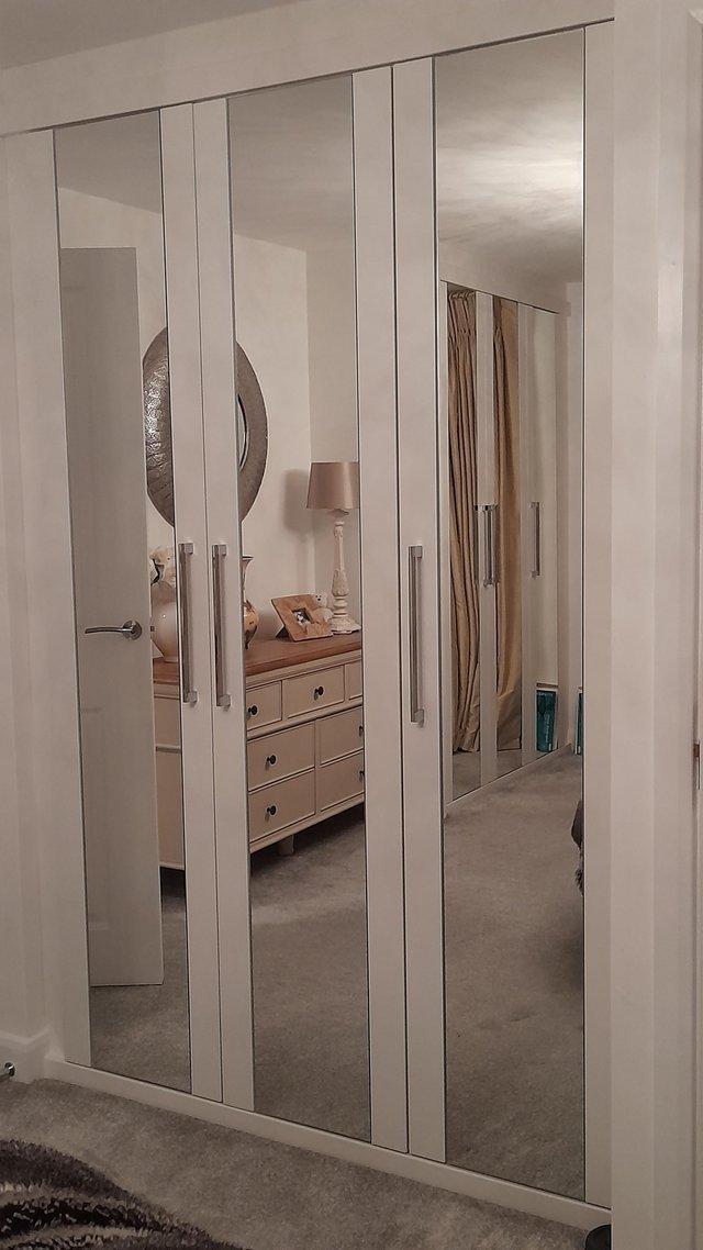 Preview of the first image of THREE MIRRORED DOORS WITH FITTINGS *price slashed*.