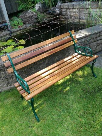Image 1 of 8 slat garden bench with cast iron ends