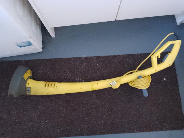 Preview of the first image of Garden yellow lightweight strimmer.