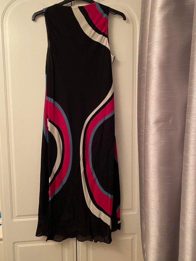 Preview of the first image of Planet dress very stylish black colour with bold print.