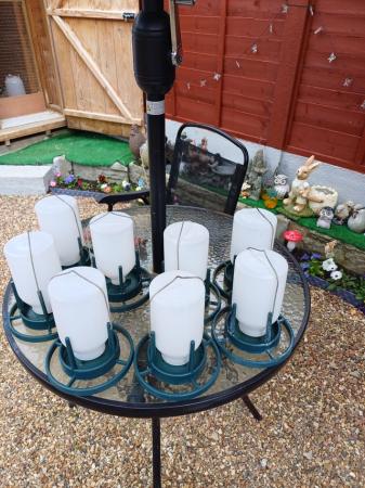Image 5 of 6 Bird feeders and  2 water pot