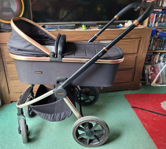 Preview of the first image of Zummi Solo Rose Gold Travel System & Isofix base.