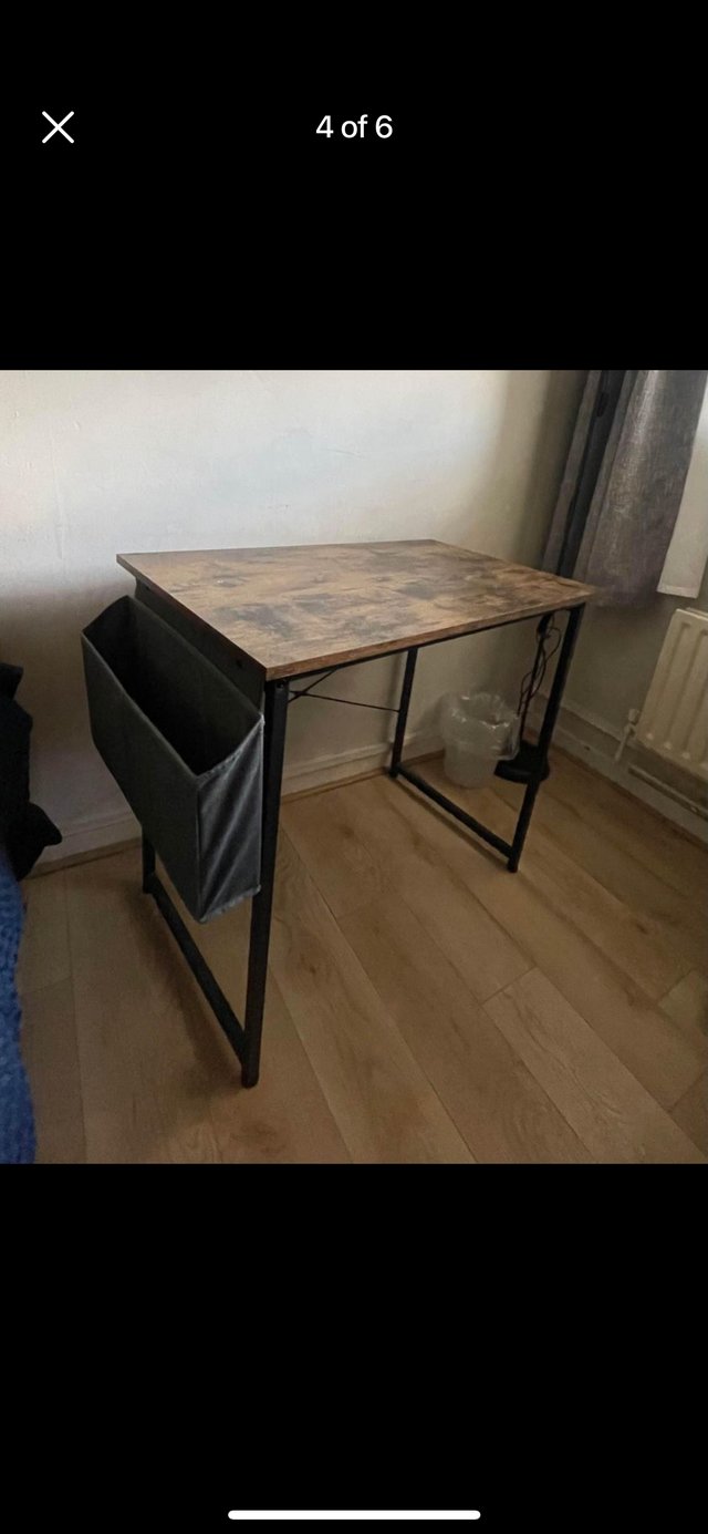 Preview of the first image of Wooden and metal desk with basket and headset hanger.