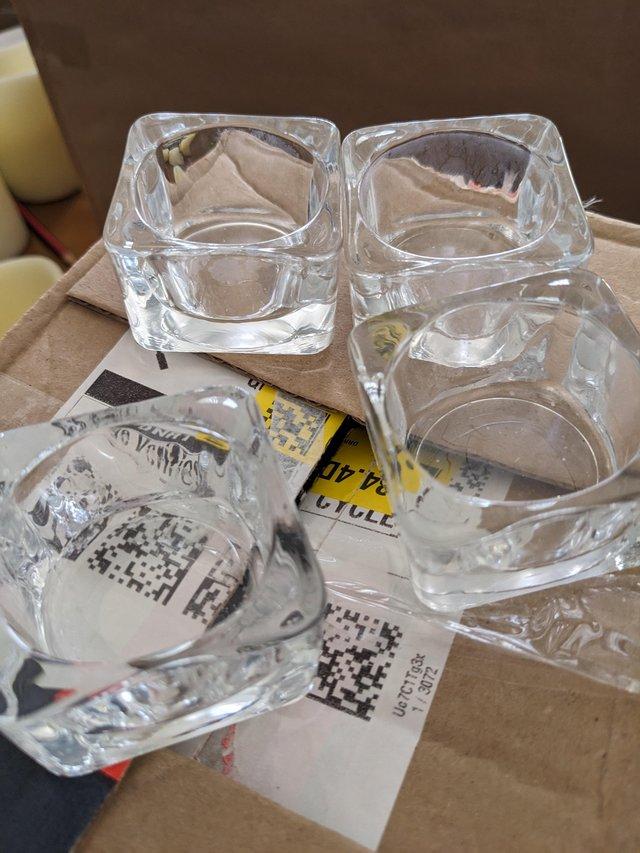Preview of the first image of 51 glass tea light holders.