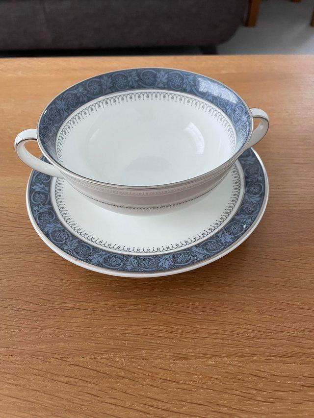 Preview of the first image of Royal Doulton soup bowls and saucers.
