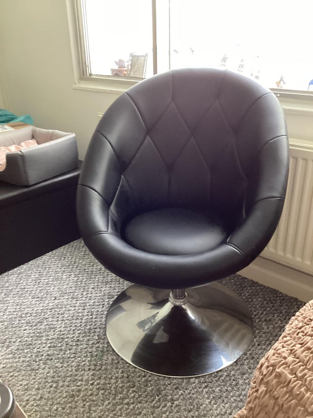 Preview of the first image of Black Faux Leather Swivel Chair.