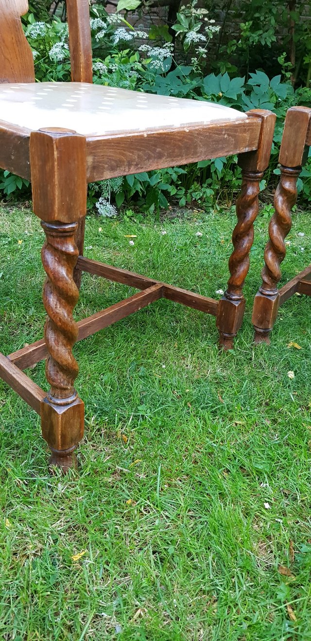 Preview of the first image of Antique solid oak pair of barley twist dining chairs.