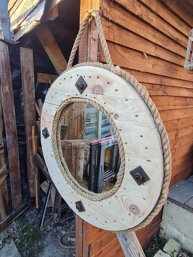 Preview of the first image of Rustic round wooden hanging mirror.