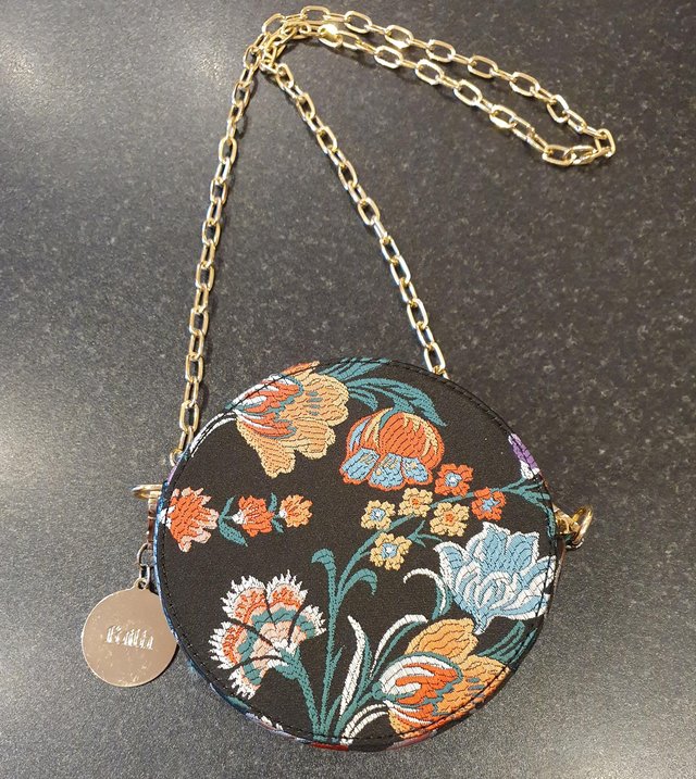 Preview of the first image of Faith Round Floral Bag with gold chain strap & charm.