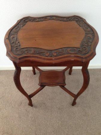 Image 1 of Two Tier Occasional Carved Table.
