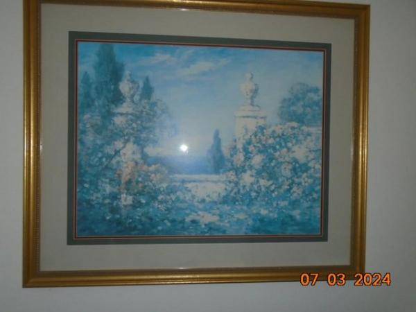Image 1 of Framed print of a garden with the sea in the background