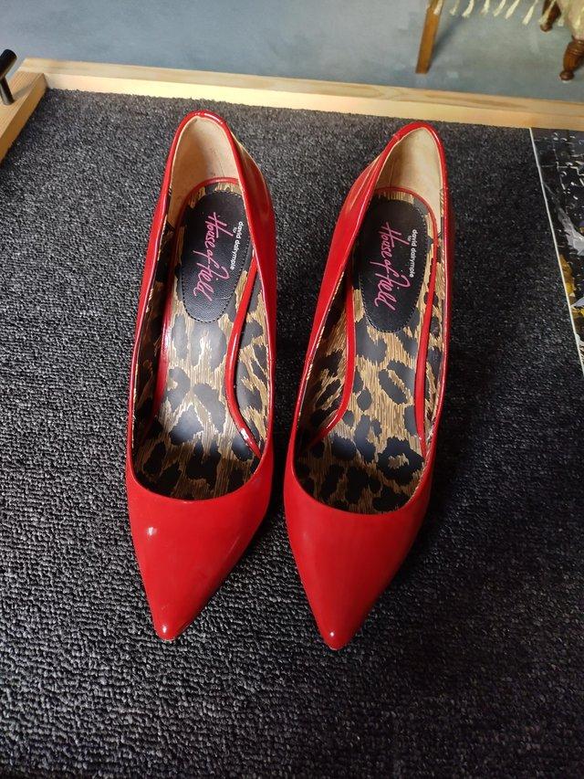 Preview of the first image of Ladies Shoes M&S pair of patent leather high heel shoes red.