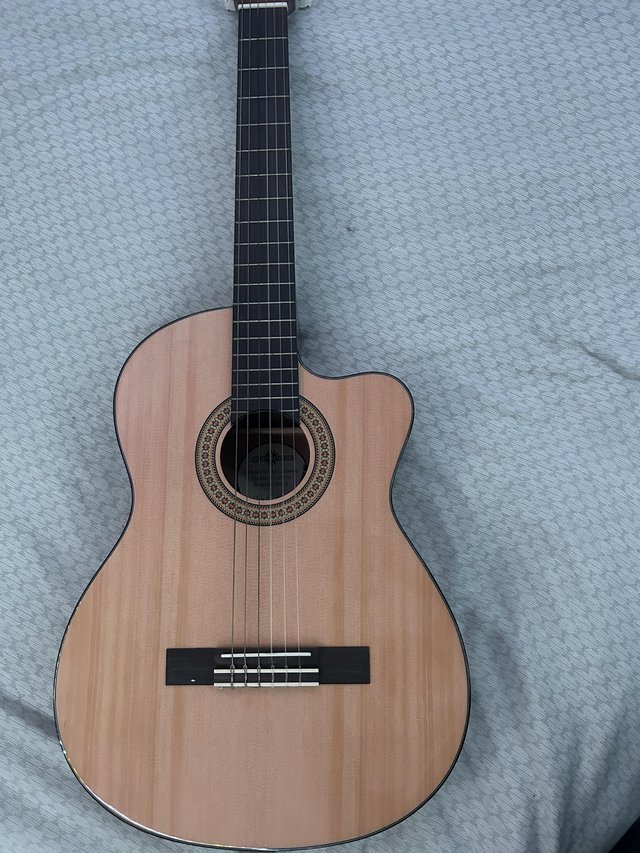 Preview of the first image of Gear for music acoustic guitar with electric pick up, self t.
