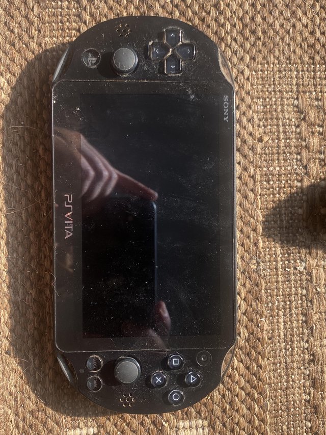 Preview of the first image of Psvita Slim console with Storage card.