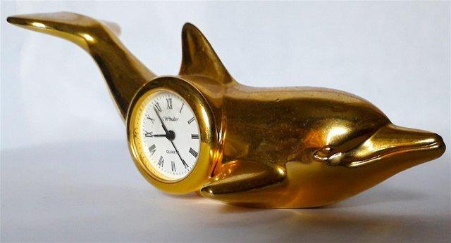 Preview of the first image of MINIATURE NOVELTY CLOCK - A DOLPHIN.