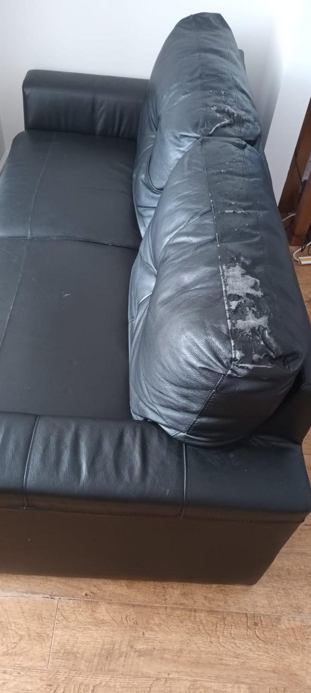 Preview of the first image of Free two seater black sofa.