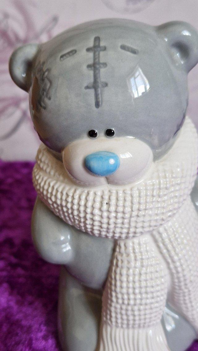 Preview of the first image of Tatty Teddy figurine money box , with blue nose.