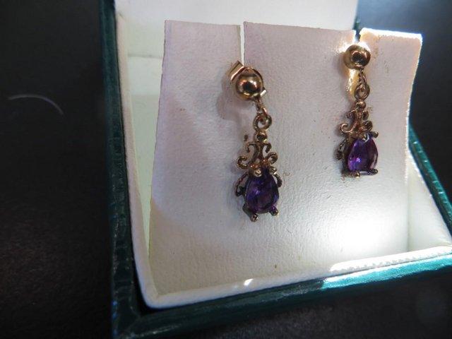 Preview of the first image of Amethyst Coloured Ear Studs in 9 carat gold.